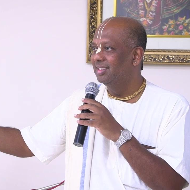 Devotee meditating by river